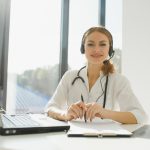 doctor talking with sick person through laptop online system and using mobile digital tablet